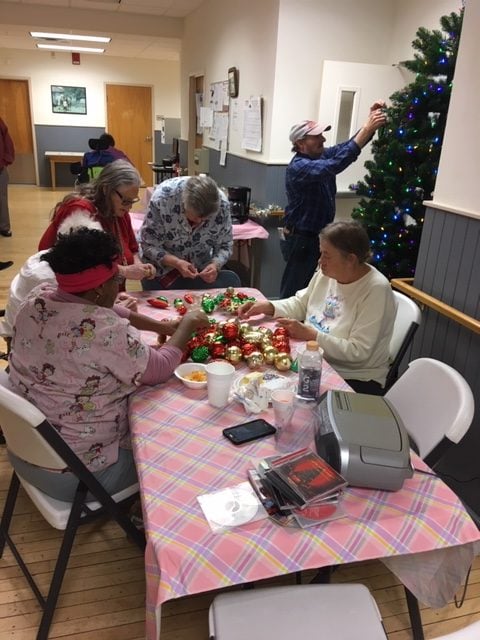 Residents decorating the Christmas tree