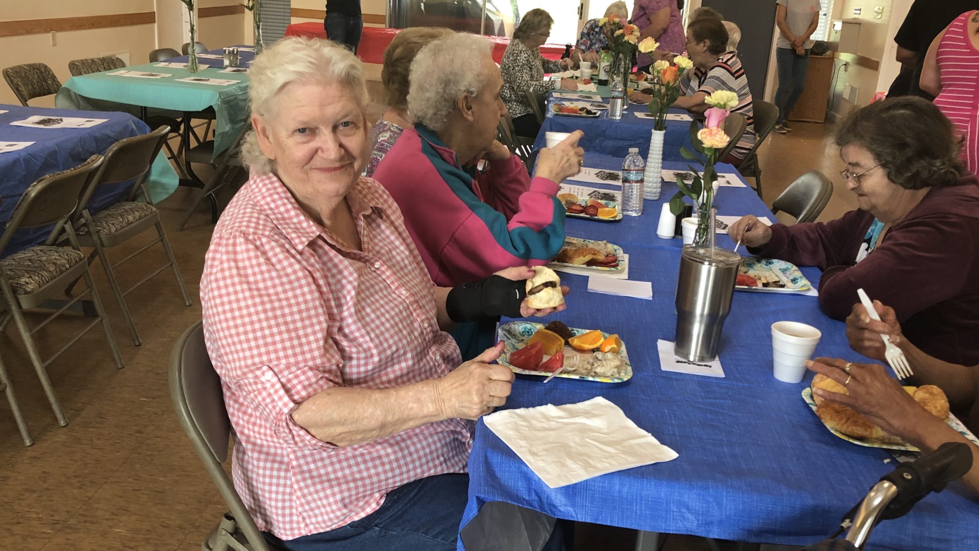 Residents eat brunch during an event at Crozet Meadows