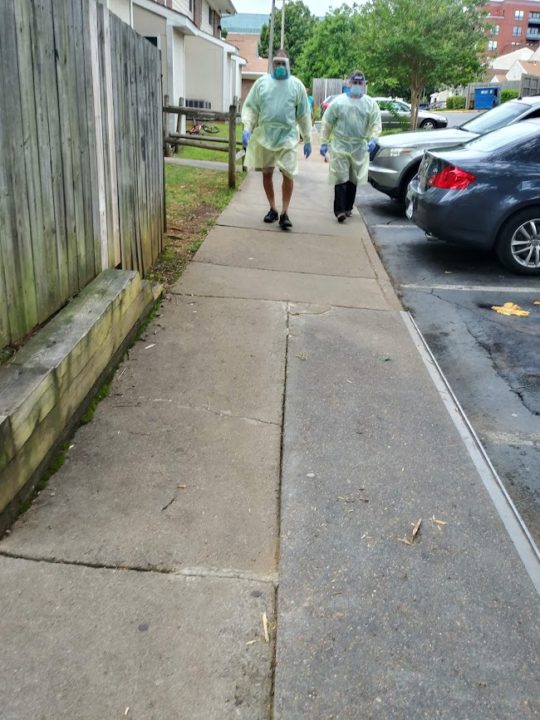 Doctors from UVA Health at Friendship Court walking on a sidewalk